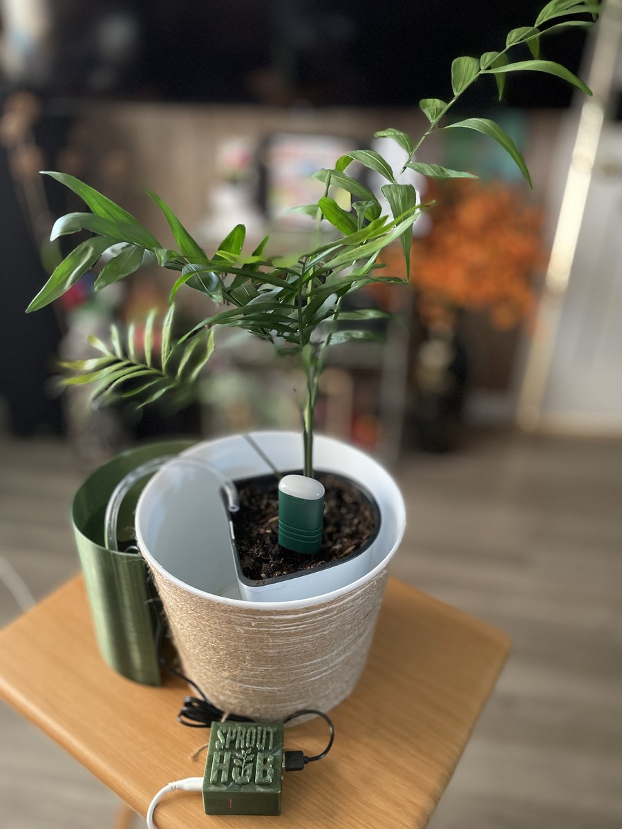 SproutKeeper complete setup — SproutHub, soil sensor, USB pump and Quartermoon water container